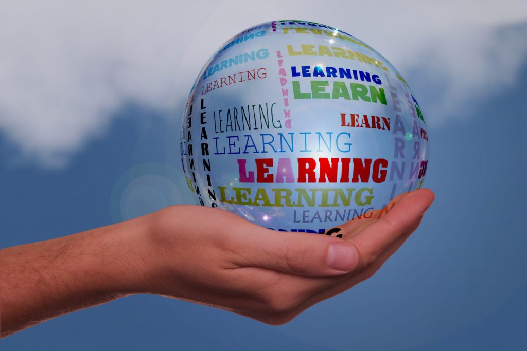 Handing holding ball with words